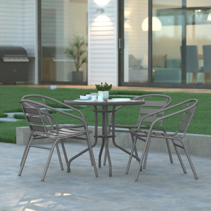 Rhea 31.5'' Round Glass Top Metal Table with 4 Aluminum Slat Stack Chairs
